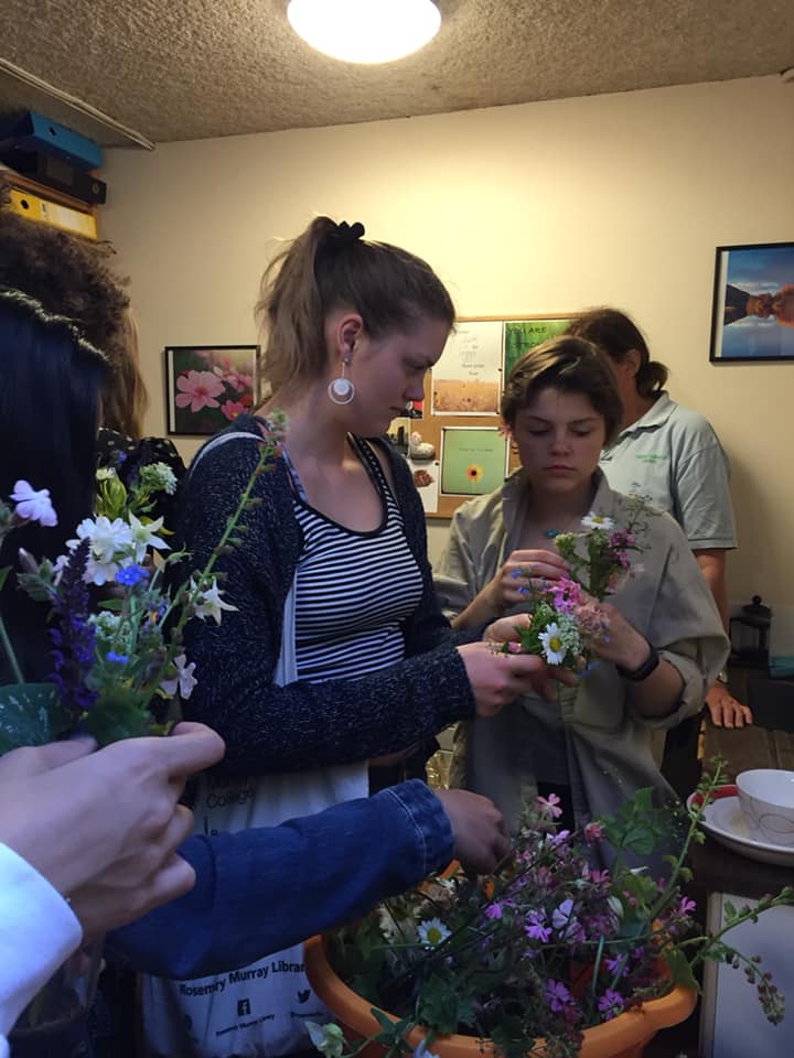 Students flower arranging during a library craft session