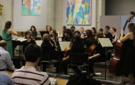 Student orchestra playing in the Dome