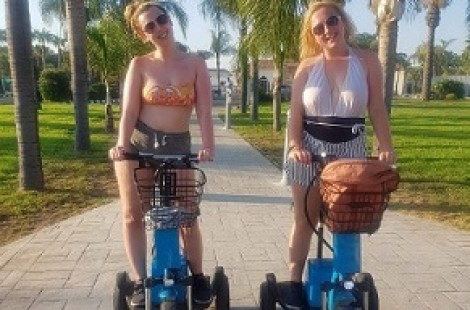 Beth Durham and her friend on a segway